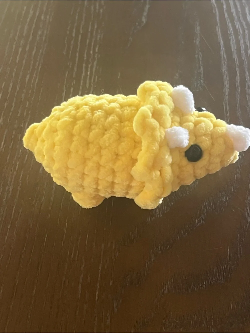 Crocheted baby triceratops dinosaur